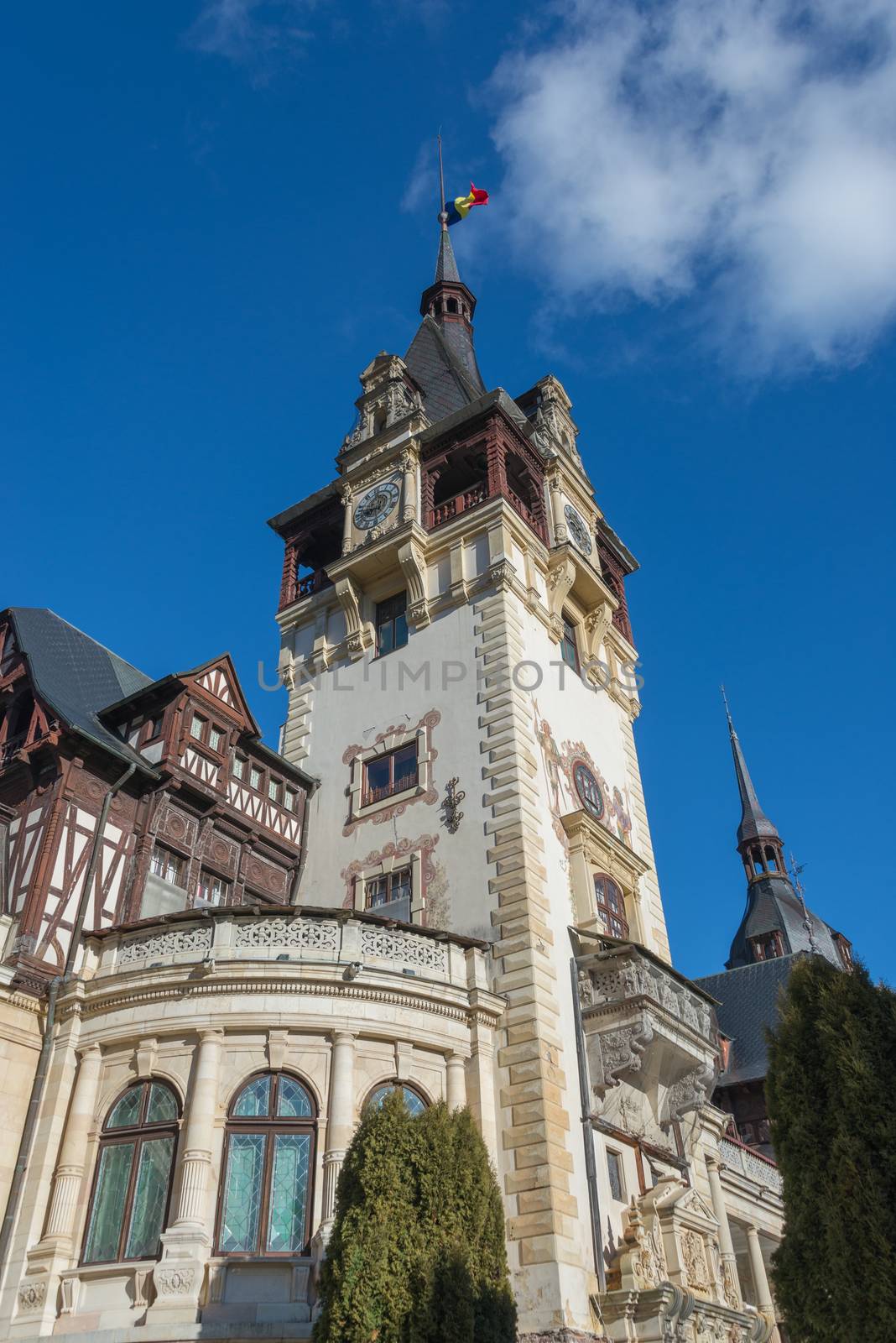 Peleș Castle near Sinaia and the Carpathian Mountains in a sunny day. Transylvania, Romania