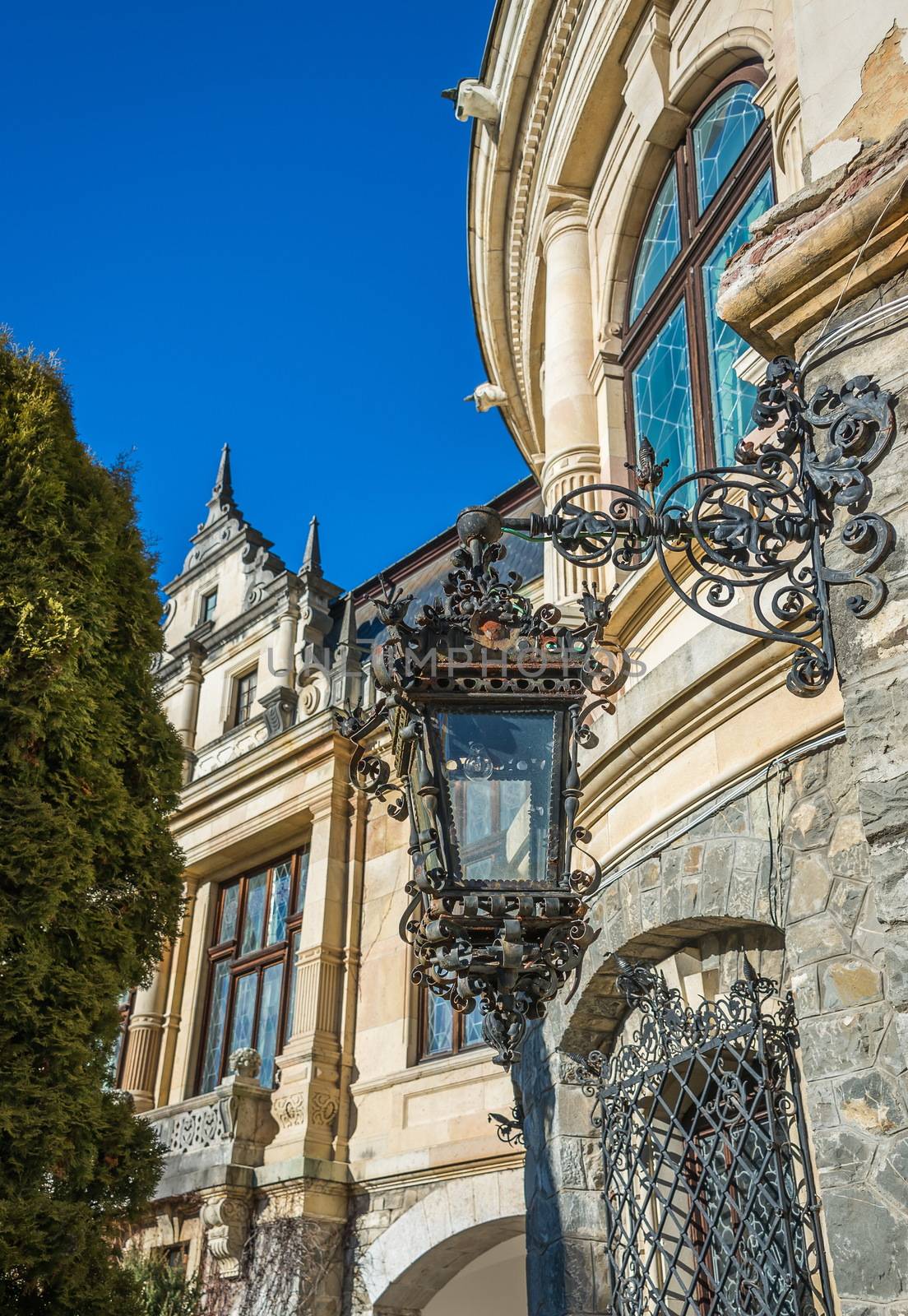 Peleș Castle near Sinaia and the Carpathian Mountains in a sunny day. Transylvania, Romania