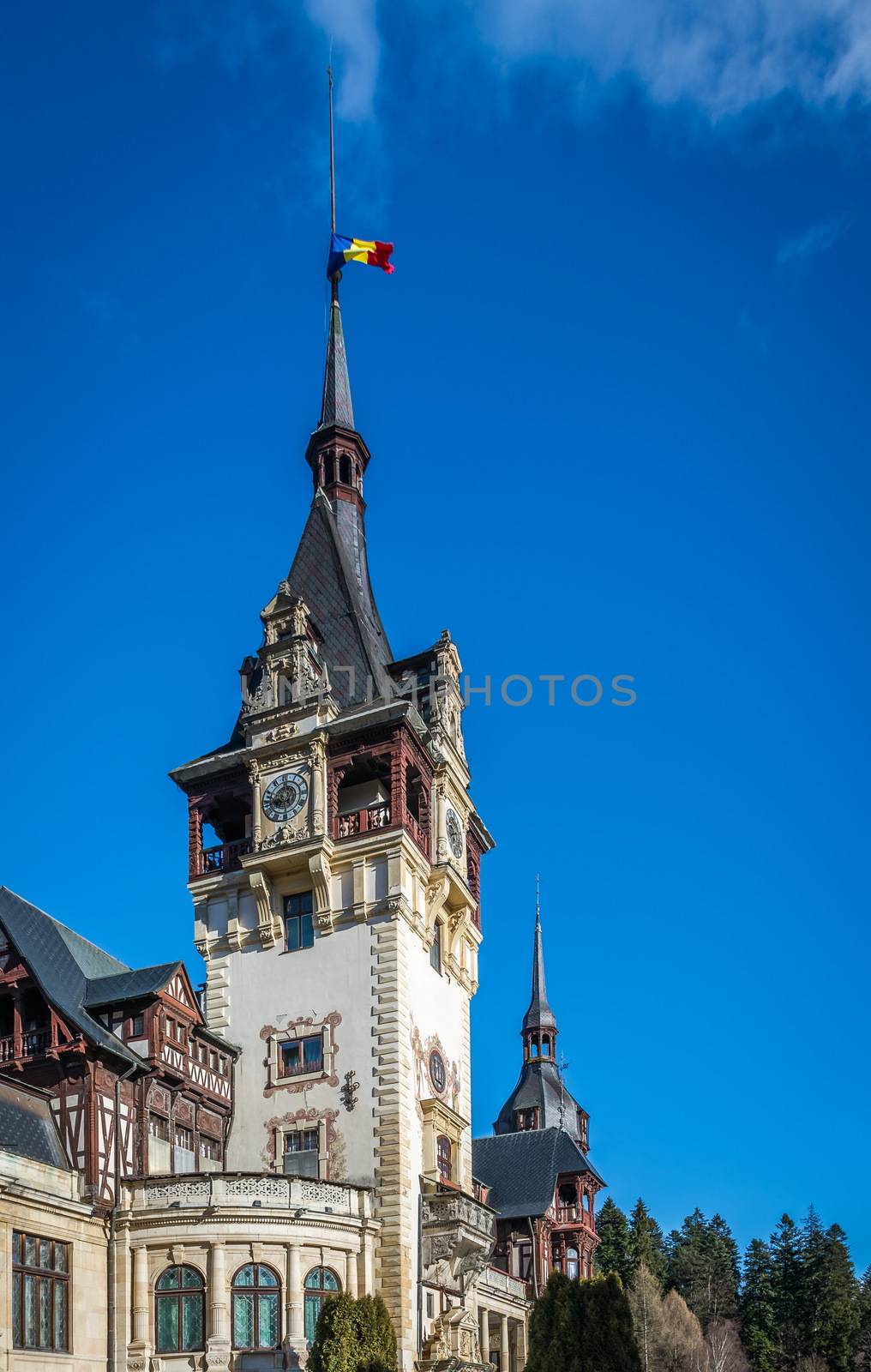 Peleș Castle near Sinaia and the Carpathian Mountains in a sunny day. Transylvania, Romania