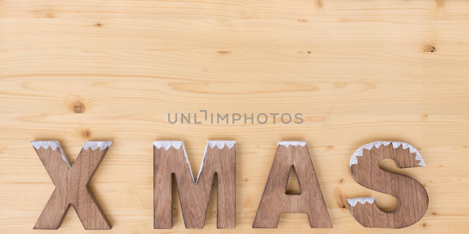The word X MAS made on wood on wood