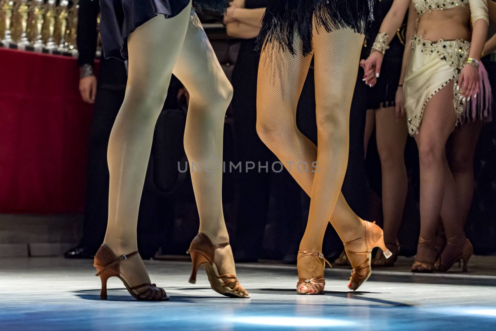 female legs of young girls who dance in competition