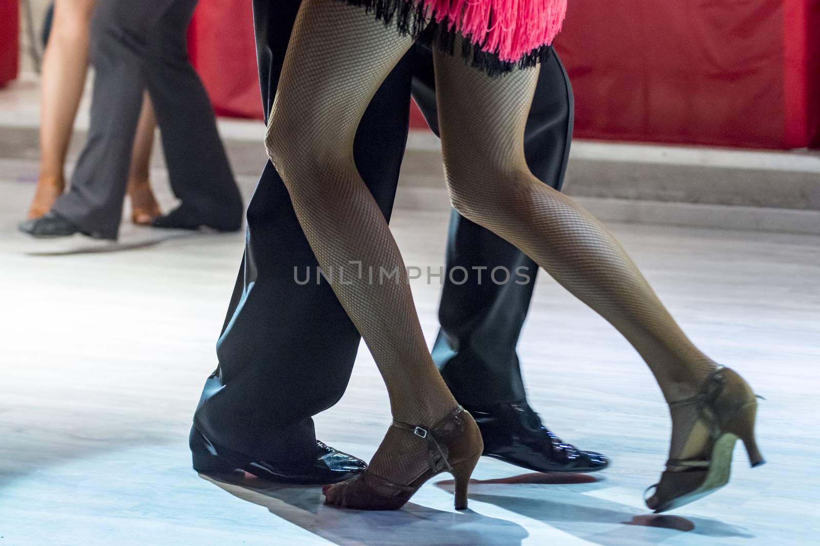 legs of a couple who dance in competition