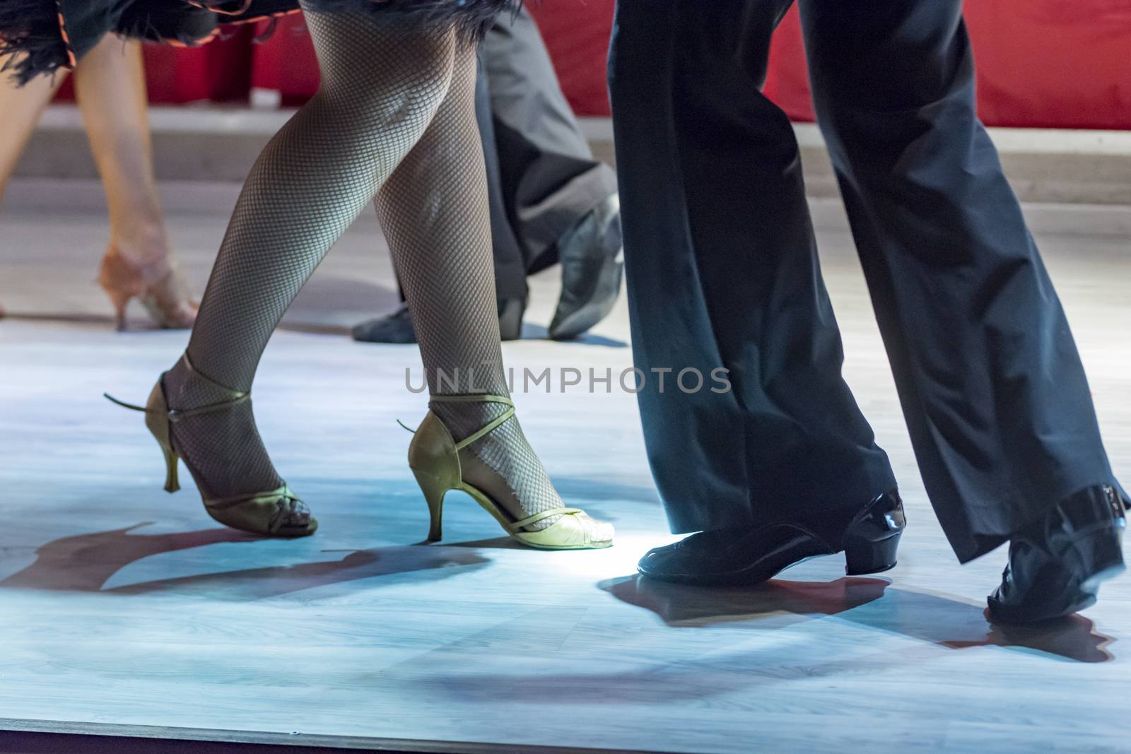 legs of a young people who dance in competition