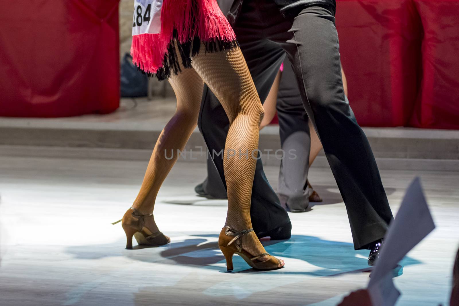 legs of a couple who dance in competition