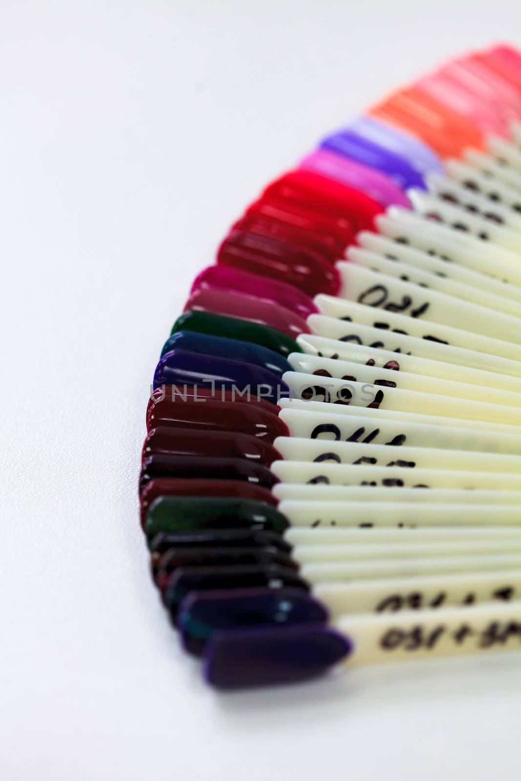 Closeup shot of nails color polish samples collection by Nobilior