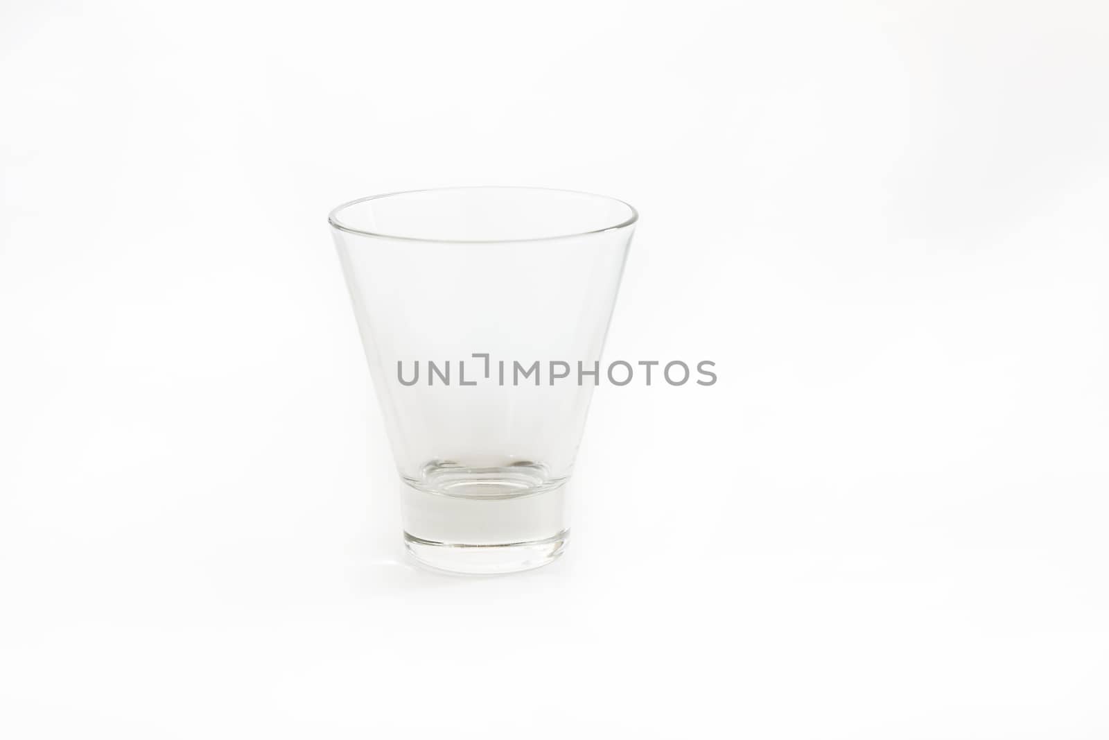 Empty glass for water, juice or milk on white background.