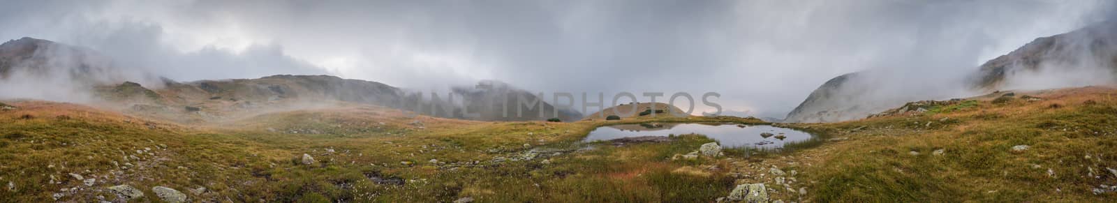 Wide Panoramic View of Small Tarn with Fog in West Tatra Mountains at Sunset