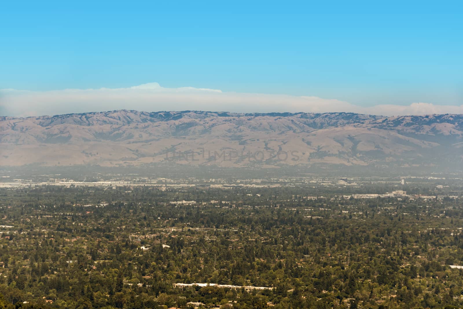 South San Francisco Bay, also called Silicon Valley, with visible smog above the area on a sunny day. The part we see on the image is south San Jose.