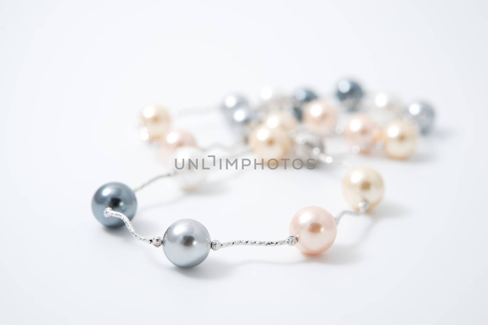 pearl necklace on white background by antpkr