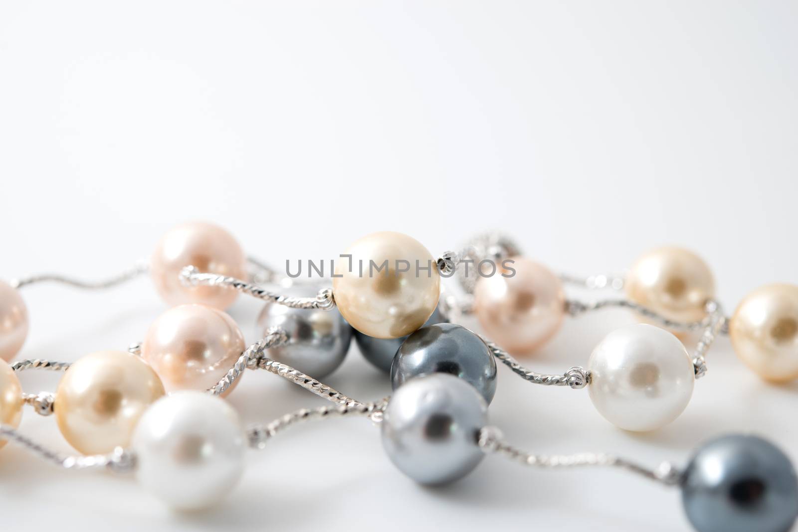 pearl necklace on white background by antpkr