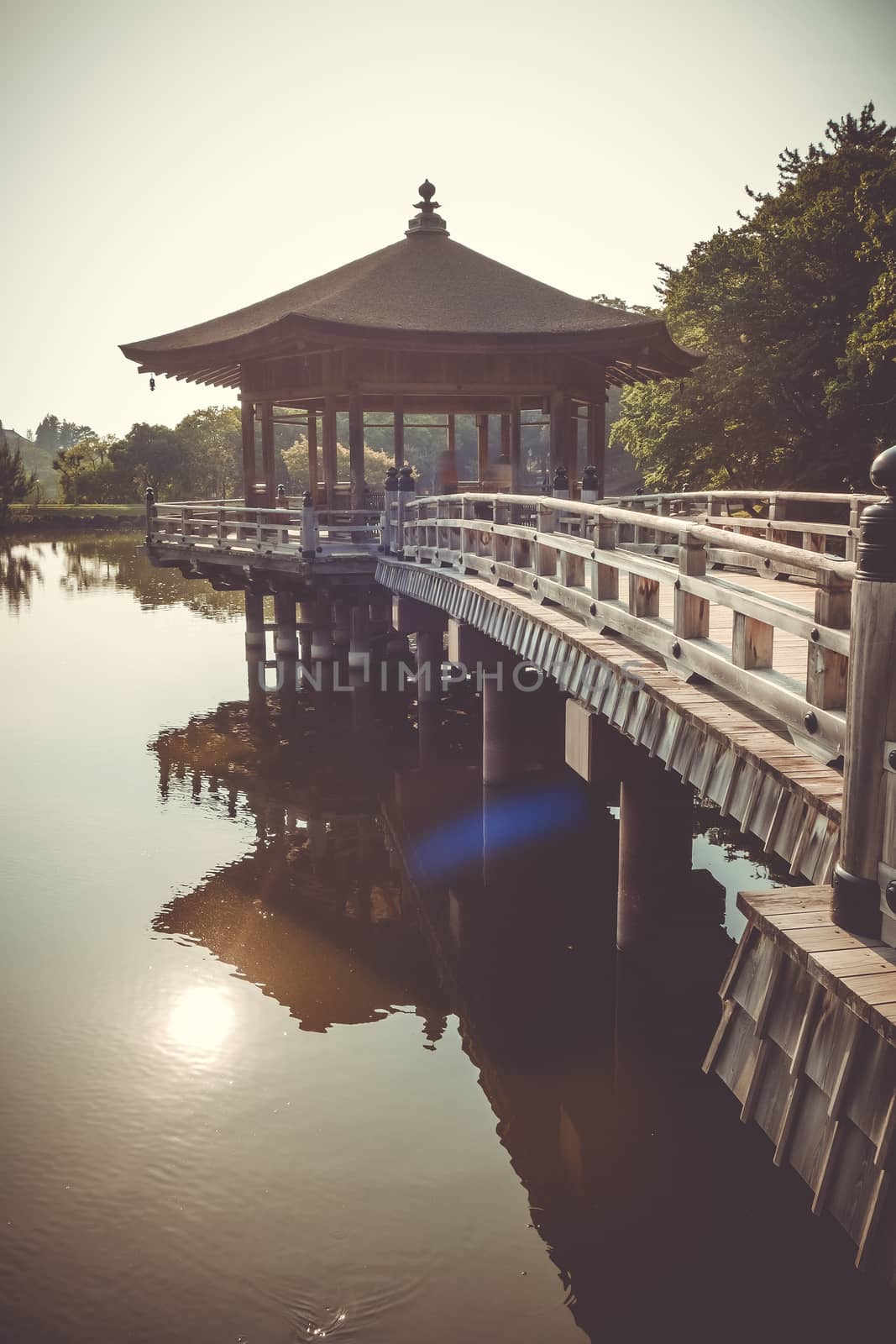 Ukimido Pavillion on water in Nara park, Japan by daboost