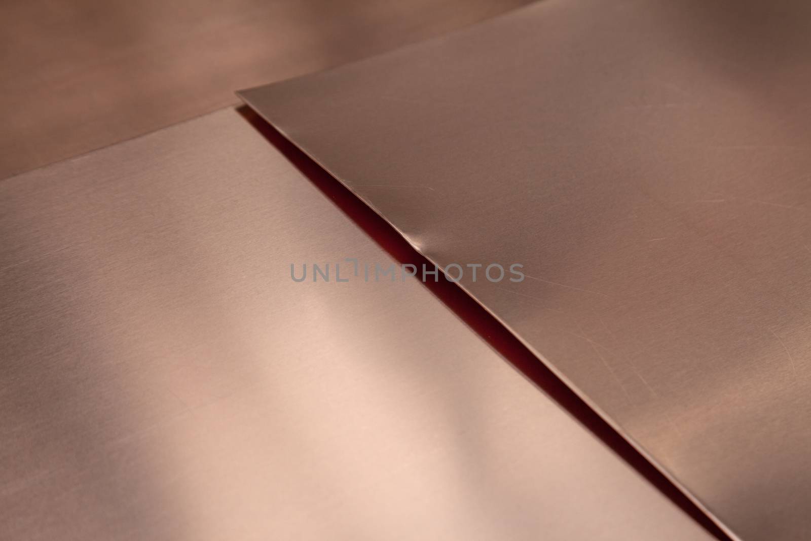 Close-up of copper sheet metal, background with copy space.