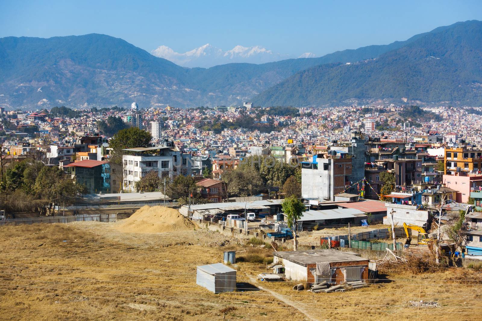 Part of Kathmandu city as seen from a vantage point, Nepal. Hills and mountains in the background.