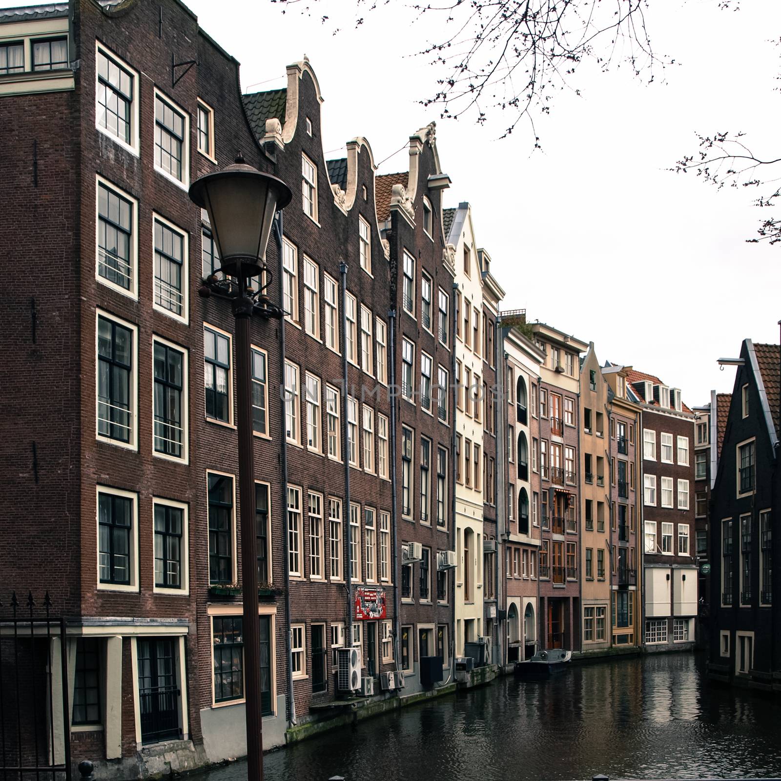 Water canal in Amsterdam city centre by pyty
