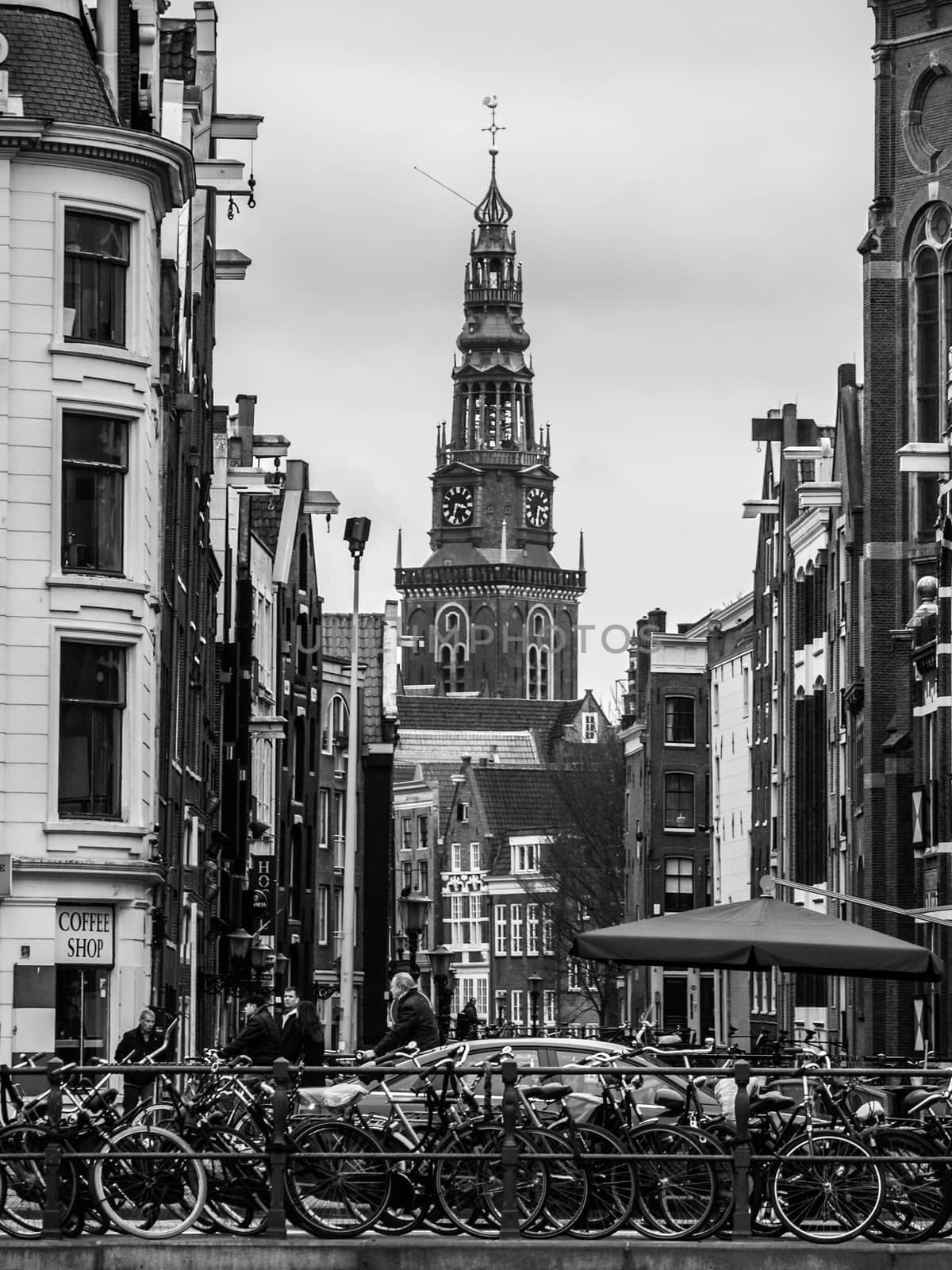 Many bicycles parked in the street Amsterdam by pyty