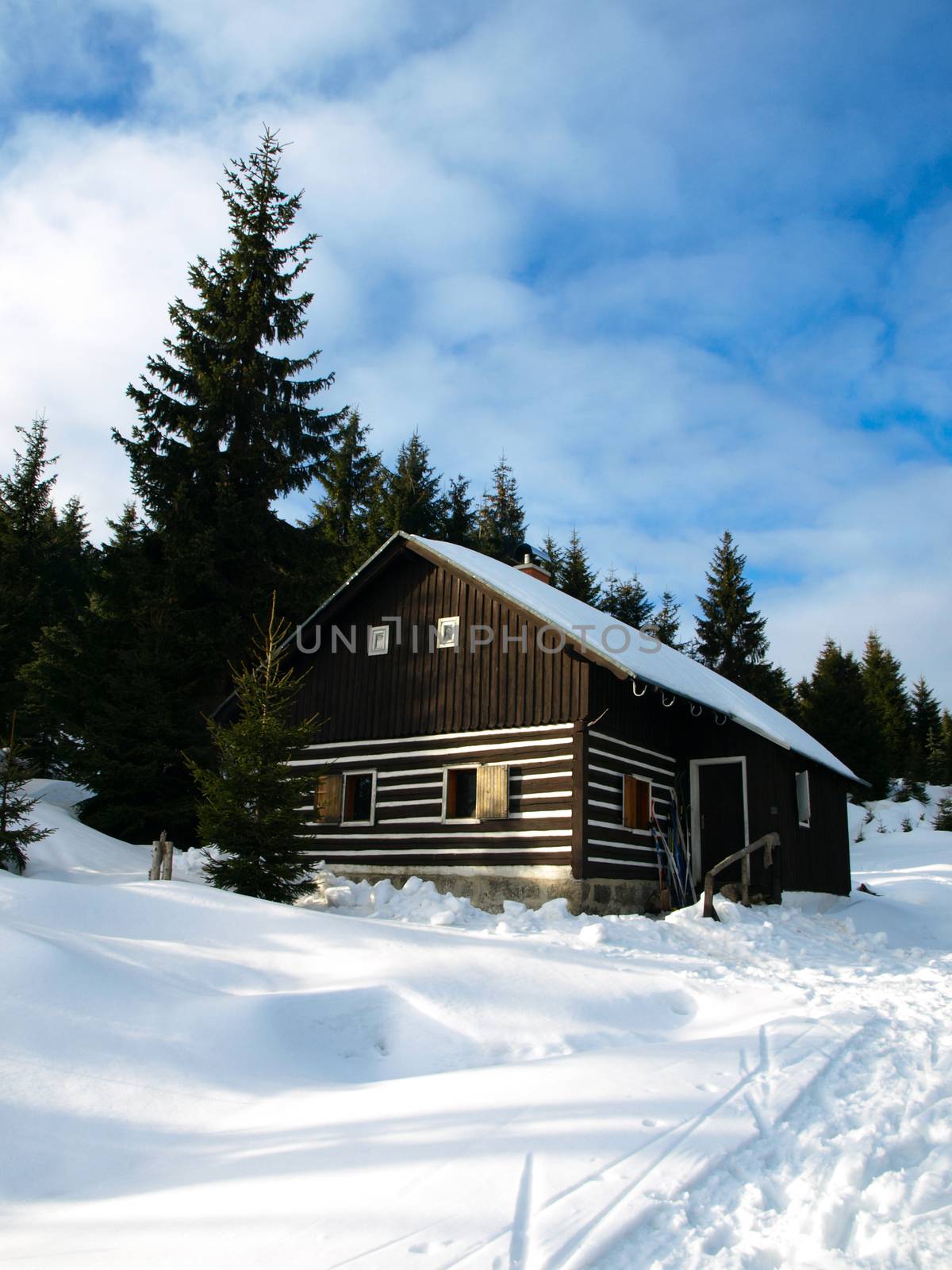 Small mountain hut in winter time, Jizera Mountains, Czech Republic