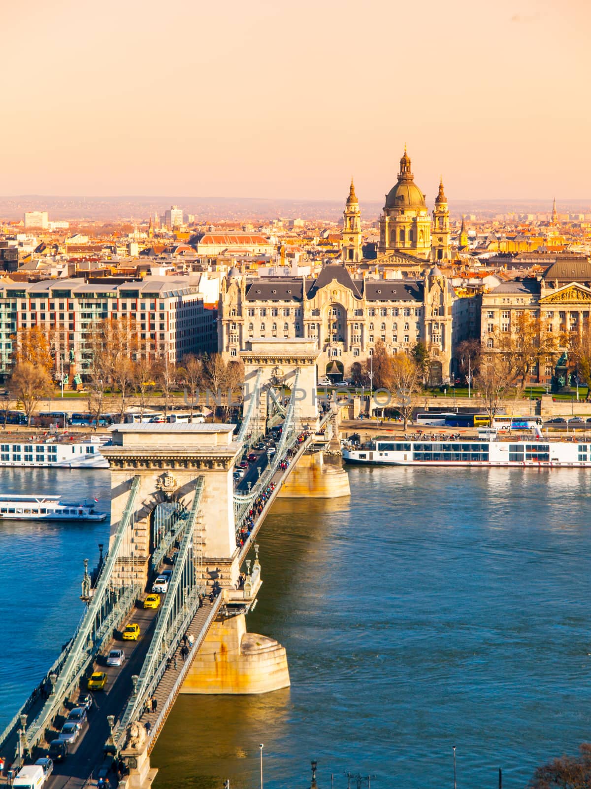 Famous Chain Bridge over Danube River and Saint Stephen's Basilica view from Buda Castle on sunny autumn day in Budapest, capital city of Hungary, Europe. UNESCO World Heritage Site