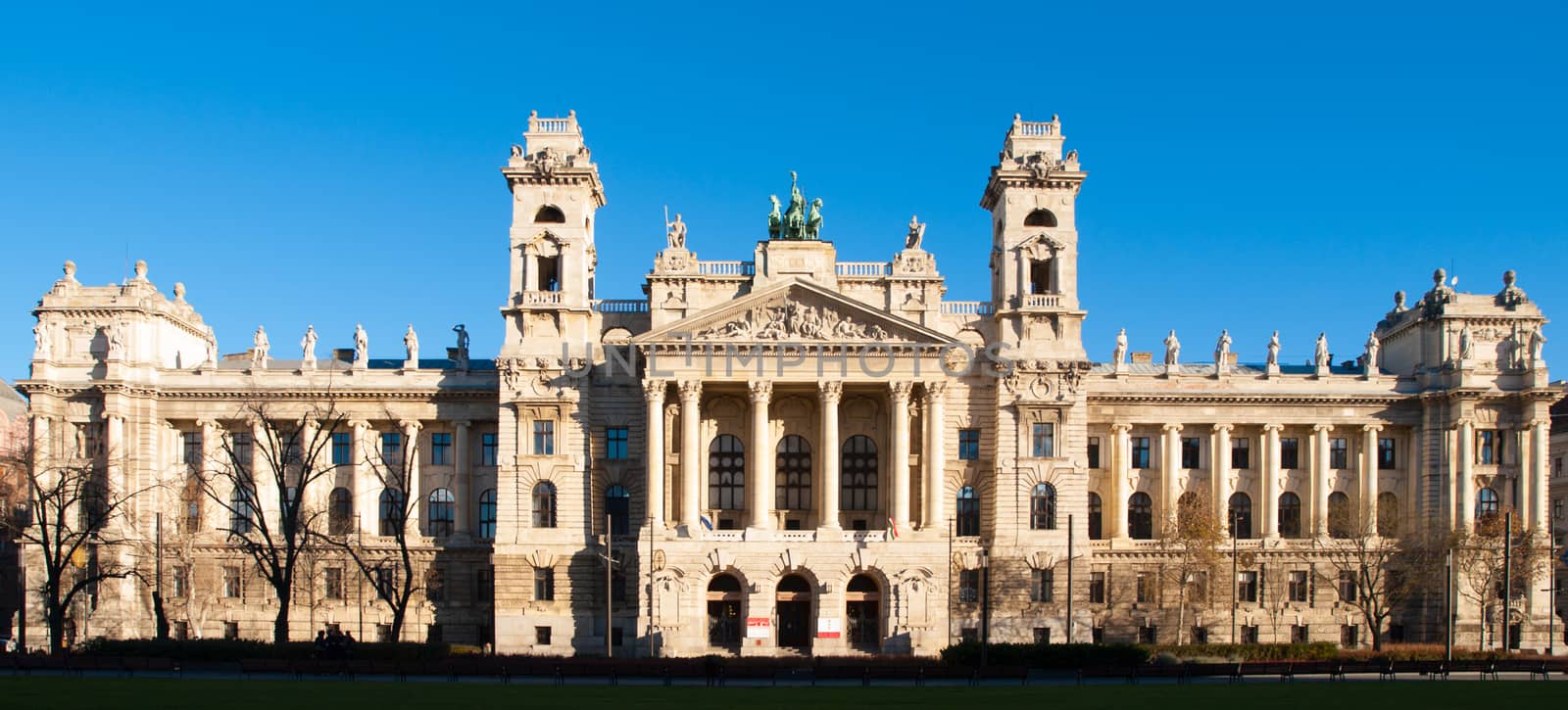 Hungarian National Museum of Ethnography, aka Neprajzi Muzeum, at Kossuth Lajos Square in Budapest, Hungary, Europe. Front view of entrance portal with two towers and architectural columns on sunny day with clear blue sky. UNESCO World Heritage Site.