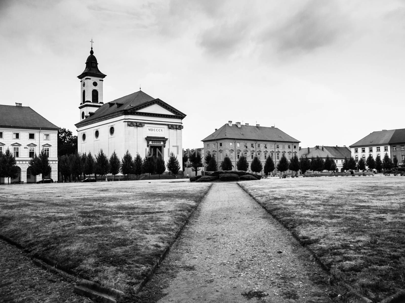 Czechoslovak Army Square with baroque church in Terezin fortress town, Czech Republic, black and white image