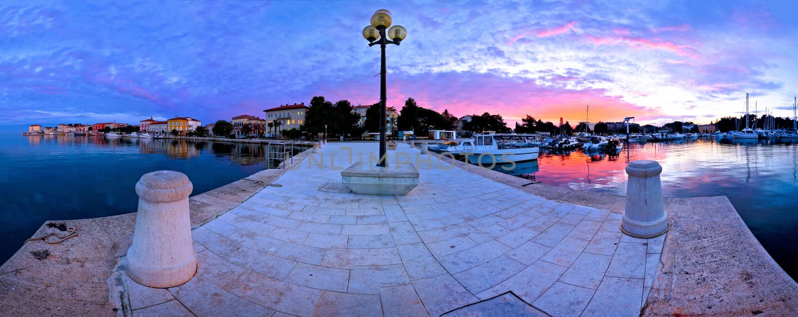 Town of Porec morning sunrise panoramic view from pier, Istria region of Croatia