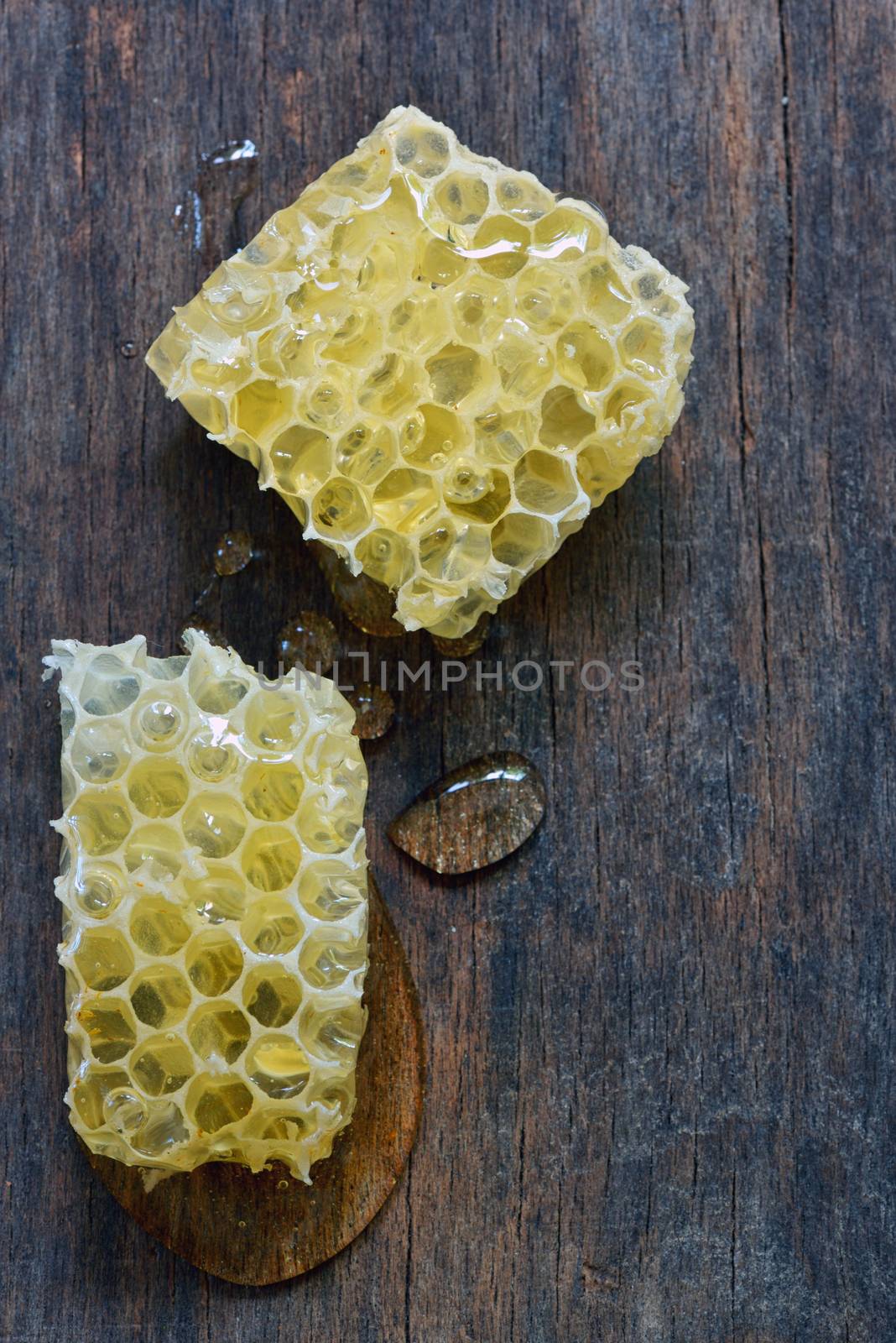 Honeycomb on a vintage wooden background