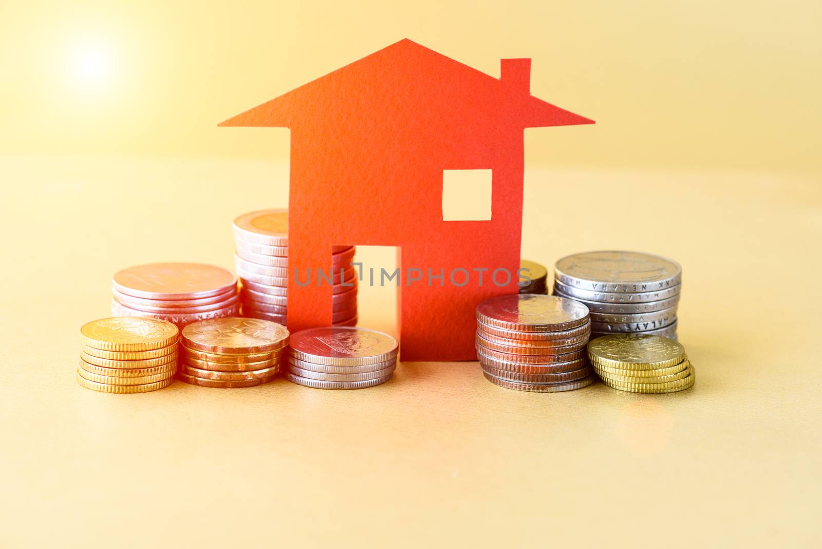Mortgage concept by money house from the coins. Business finance by spukkato