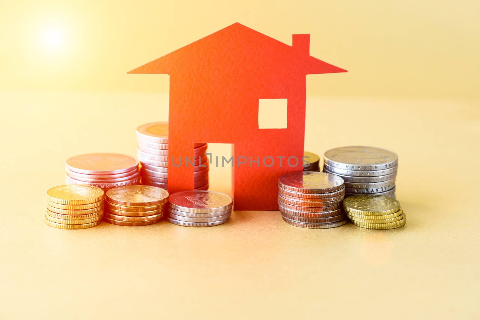 Mortgage concept by money house from the coins. Business finance and money saving concept.