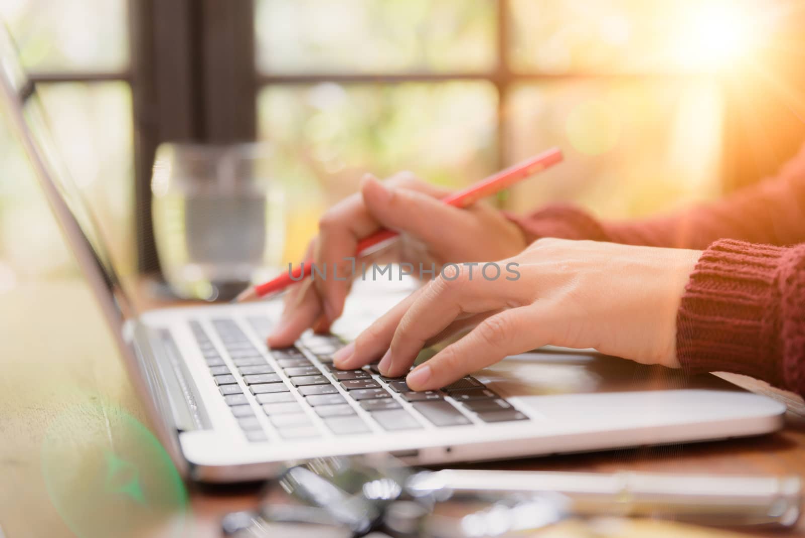 Soft focus Closeup woman hand working on her laptop. Social netw by spukkato