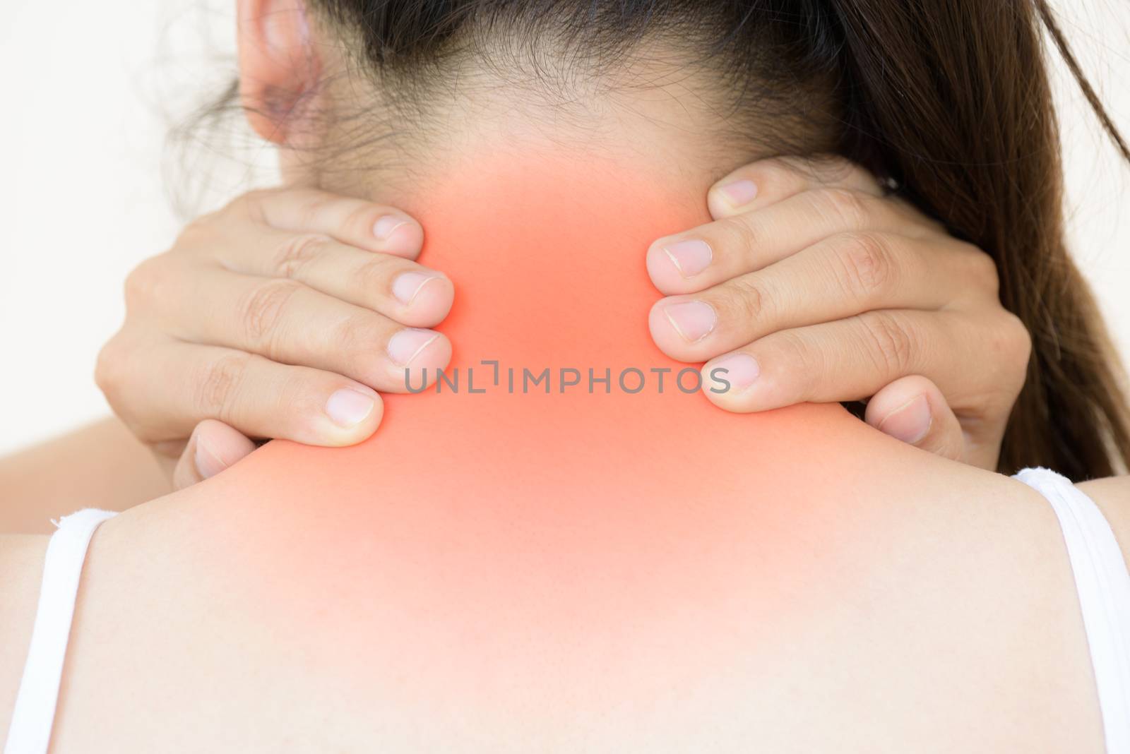 Closeup woman neck and shoulder pain and injury. Health care and medical concept.