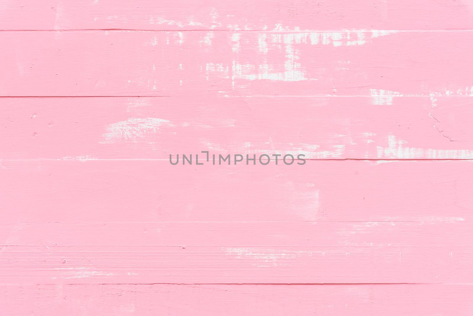 Pastel white and pink wooden table background texture.