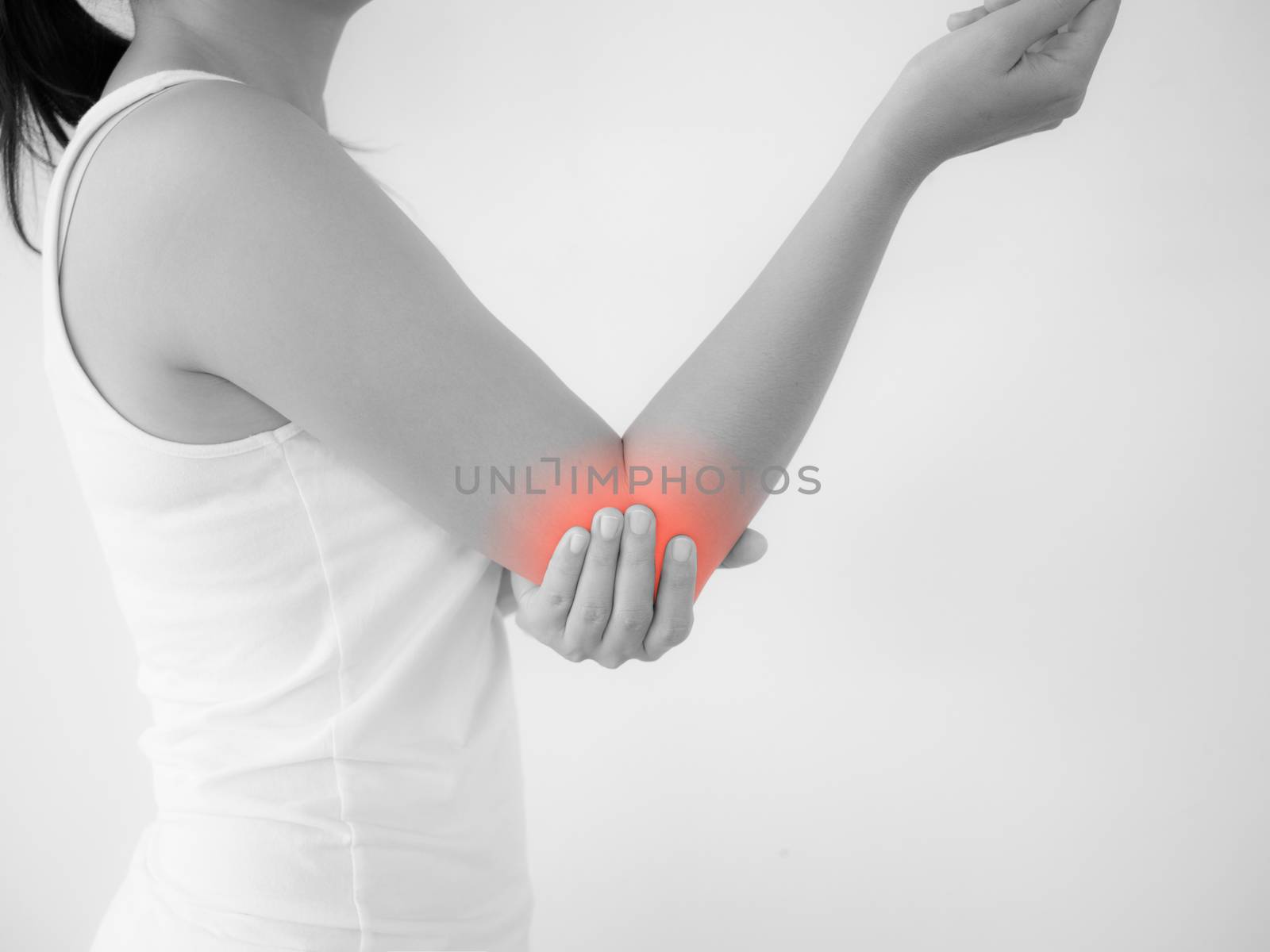 Close up woman having pain in injured elbow. Health care and arm pain concept.