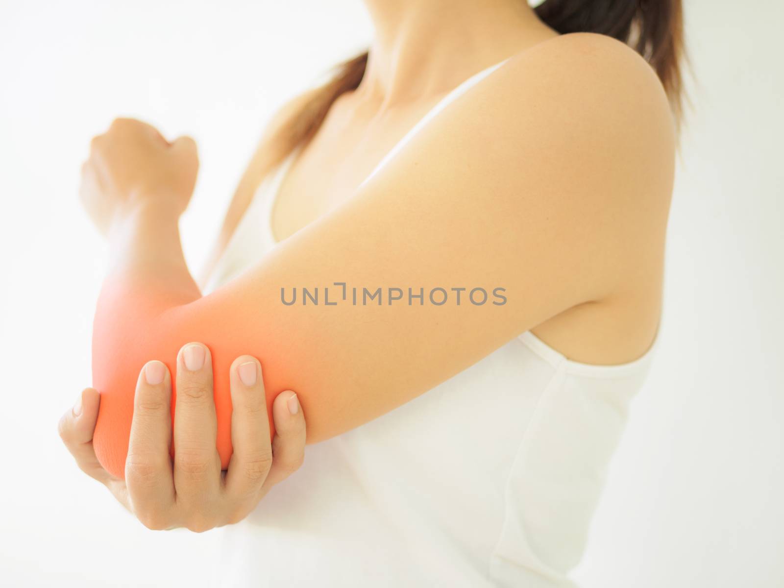 Close up woman having pain in injured elbow. Health care and arm pain concept.