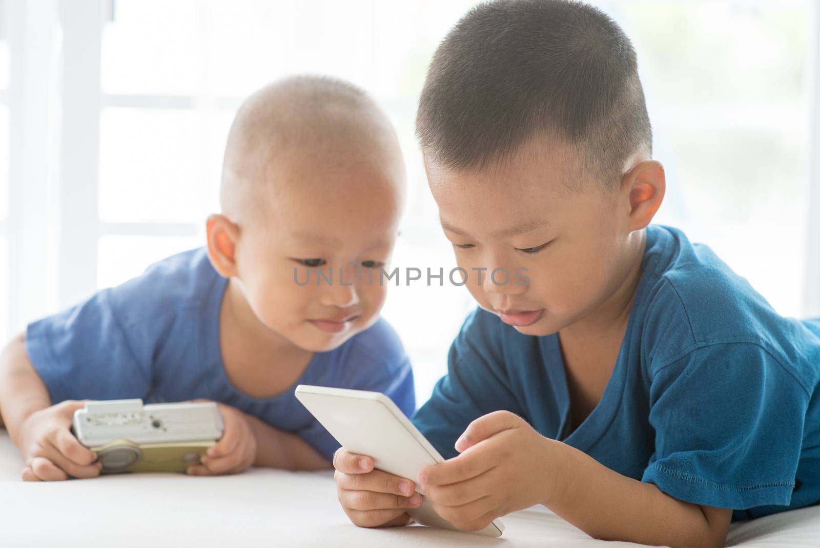 Young children addicted to smart phone. by szefei