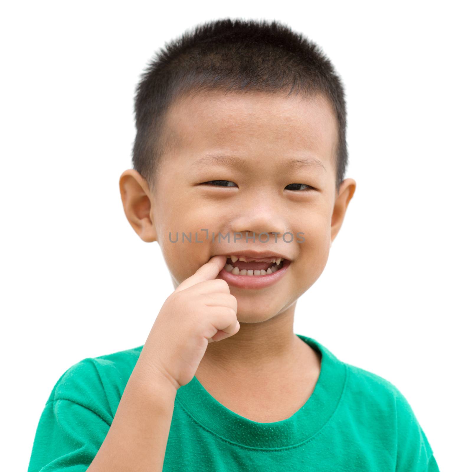 Happy Asian child smiling and pointing his teeth. Portrait of young boy showing body parts isolated on white background.