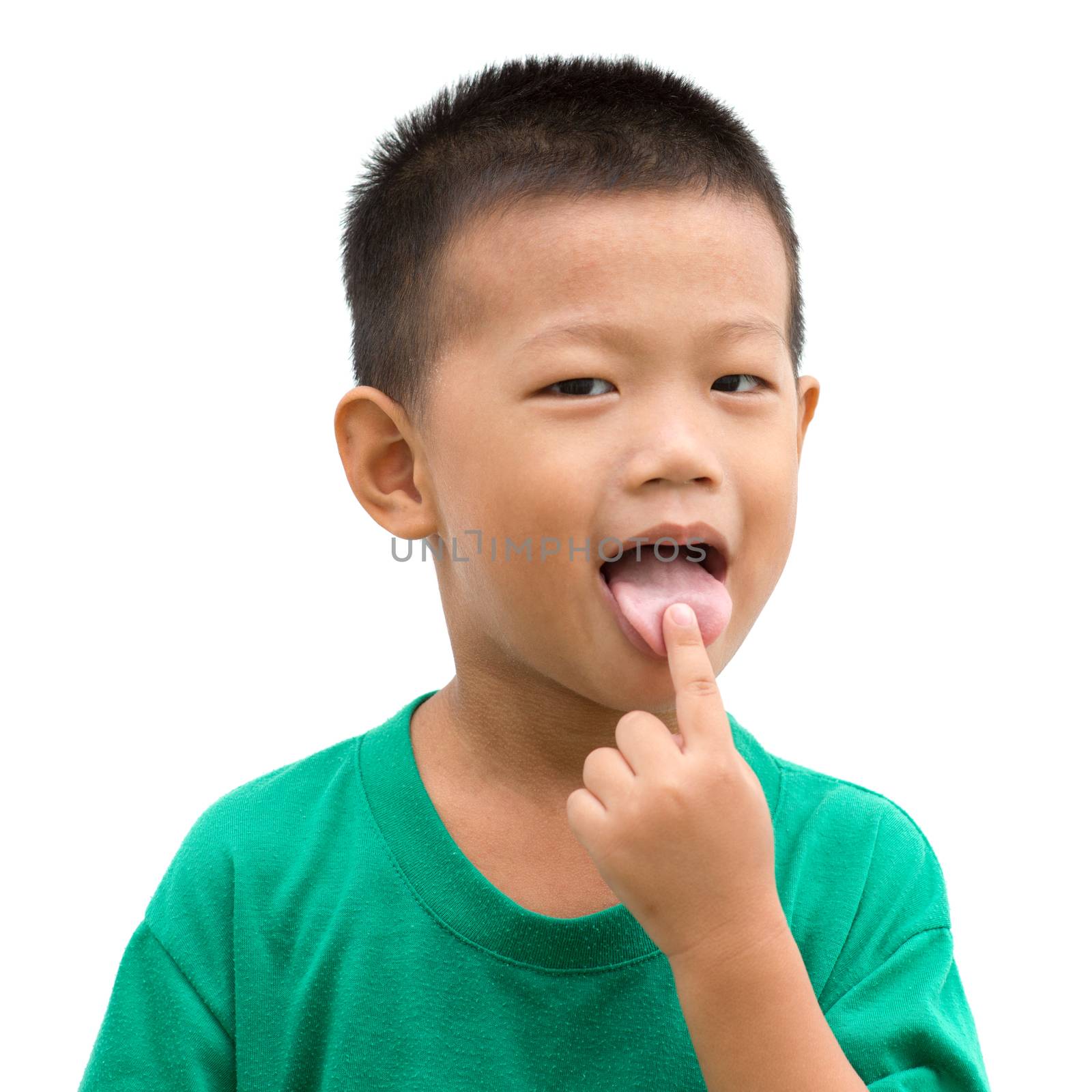 Happy Asian child pointing his tongue and smiling. Portrait of young boy showing body parts isolated on white background.