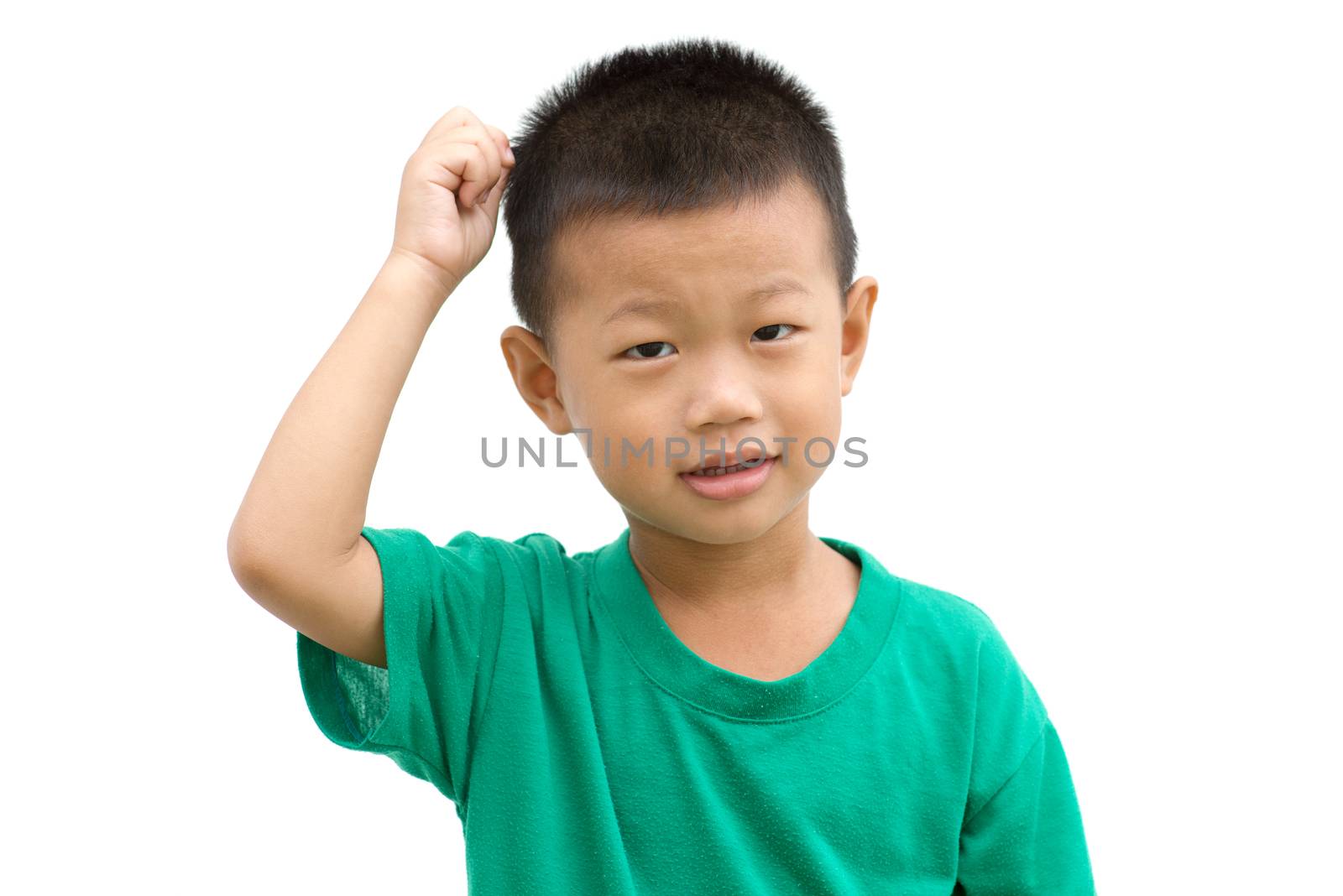 Happy Asian child pointing his hair and smiling. Portrait of young boy showing body parts isolated on white background.