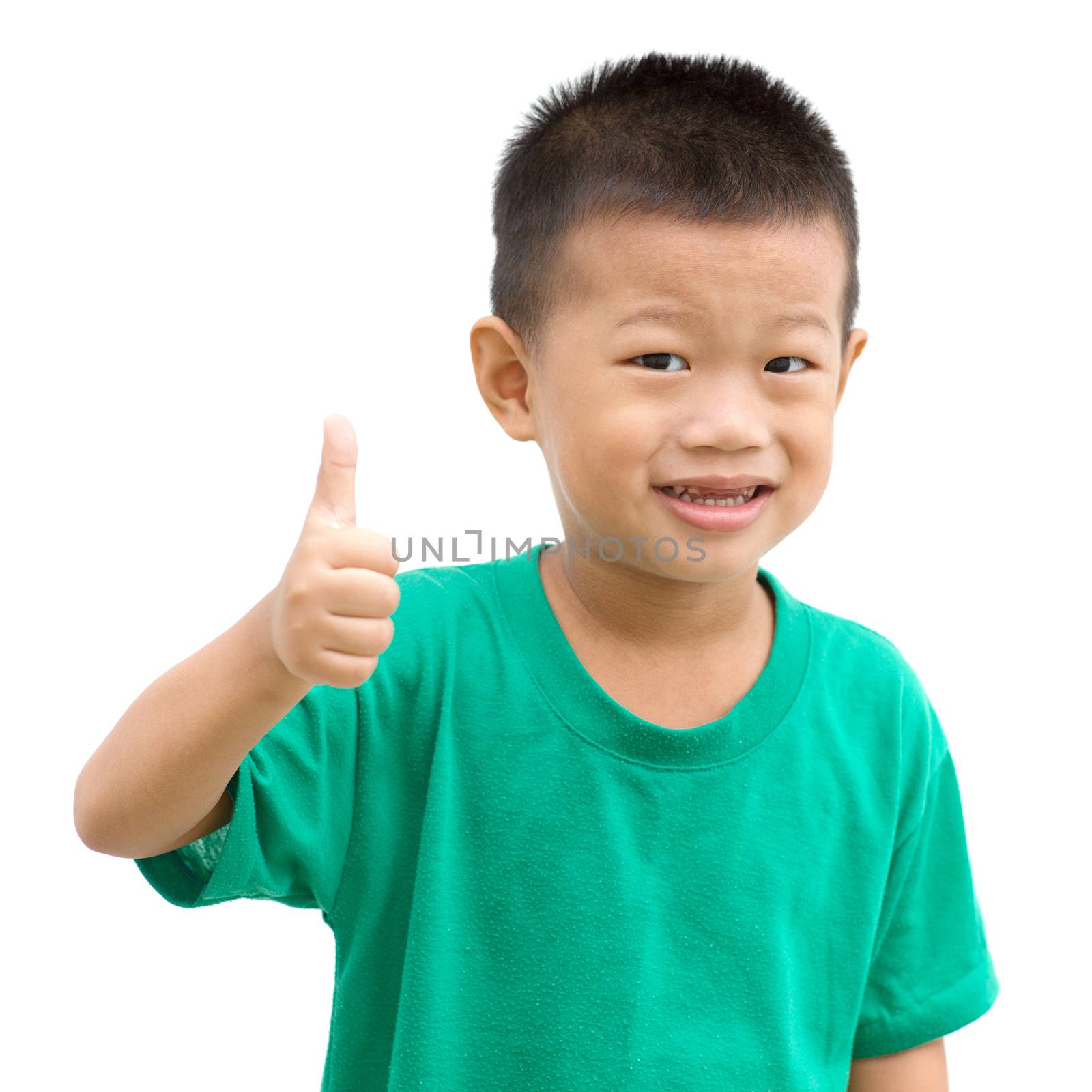 Asian child giving thumb up. Portrait of young boy isolated on white background.