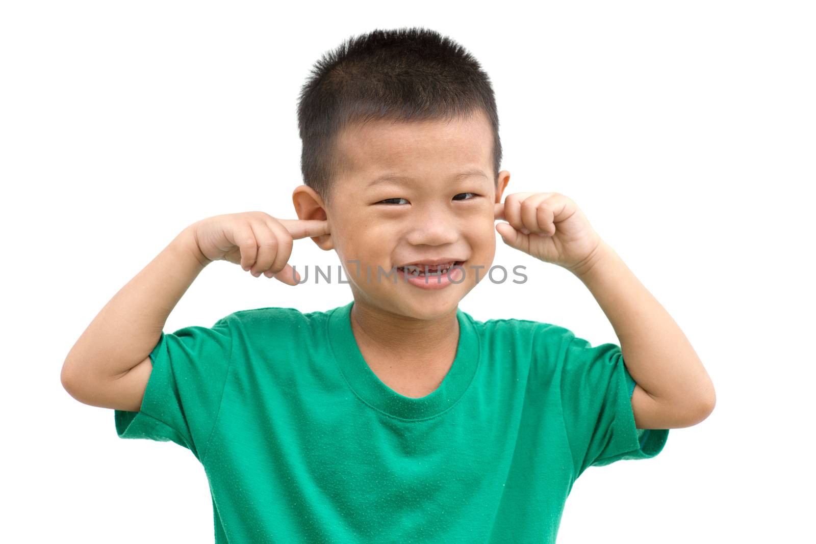 Asian child smiling and covering ears with hands. Portrait of young boy isolated on white background.