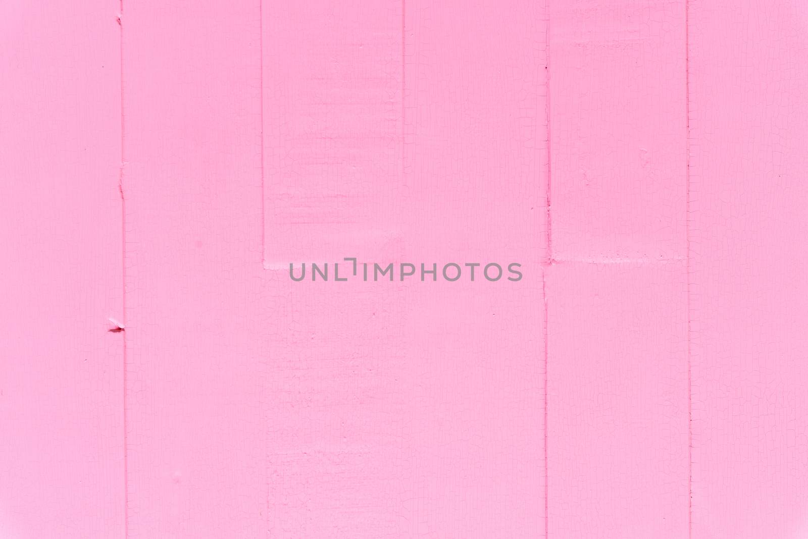 Pastel white and pink wooden table background texture.