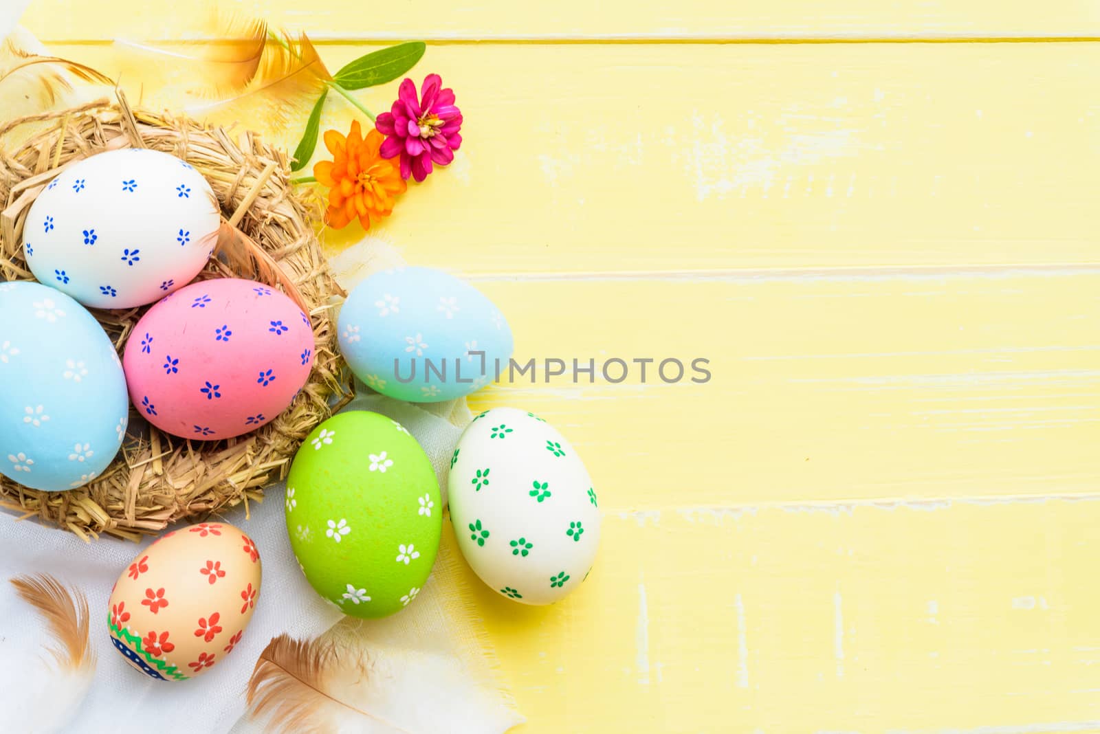 Happy easter! Colorful of Easter eggs in nest with red ribbon, F by spukkato