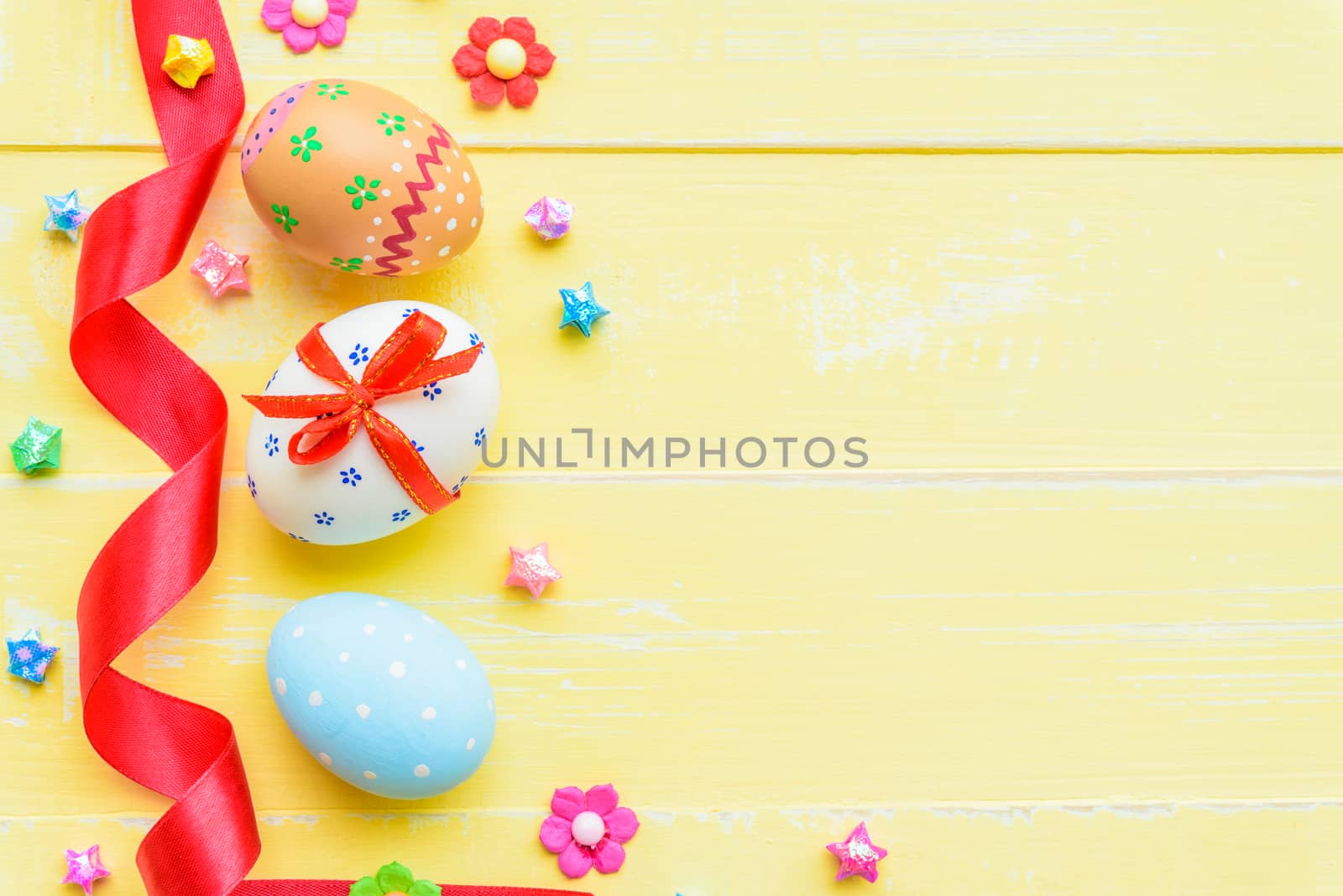Happy easter! Colorful of Easter eggs in nest with red ribbon, F by spukkato