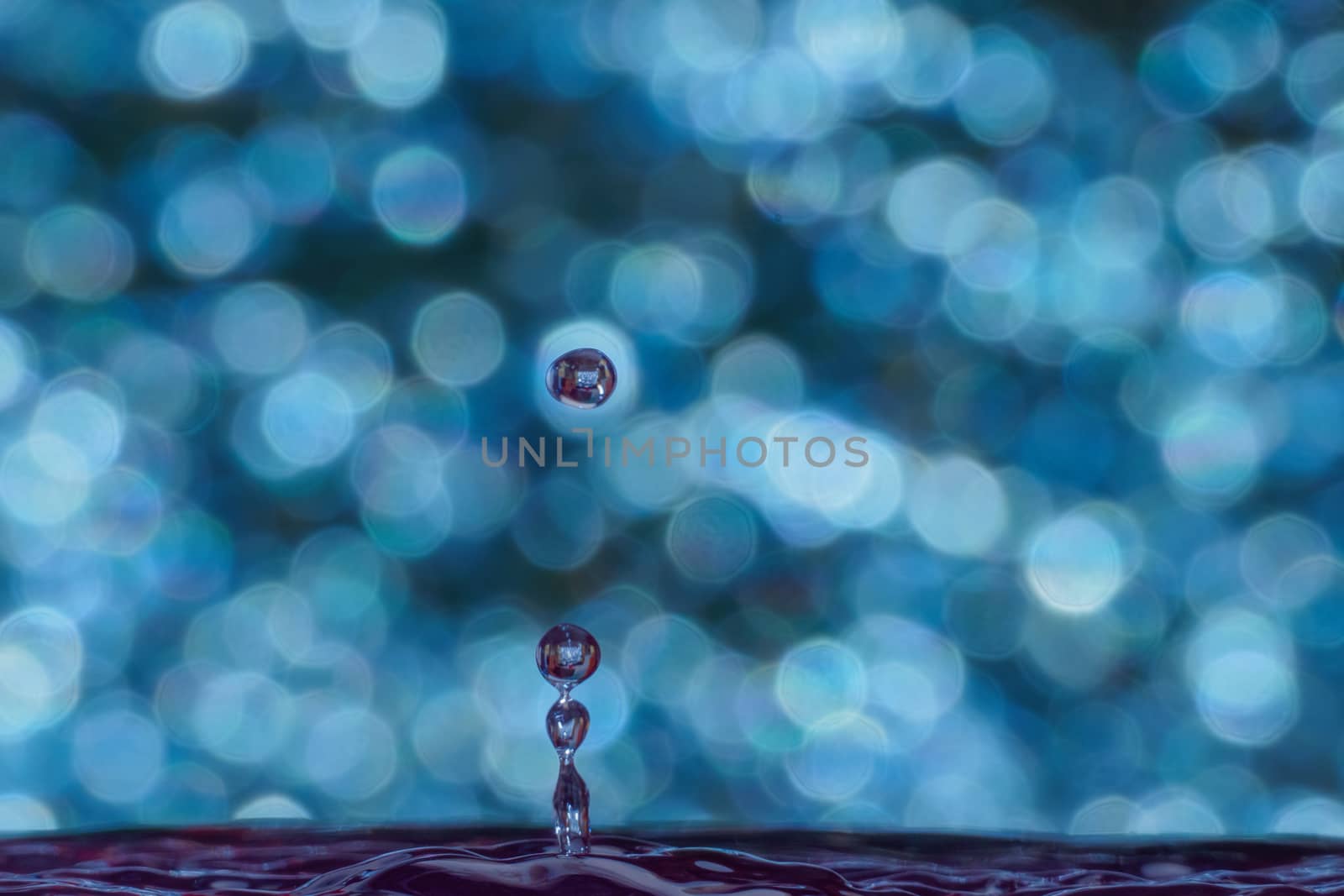 splash of water on blurry bokeh background