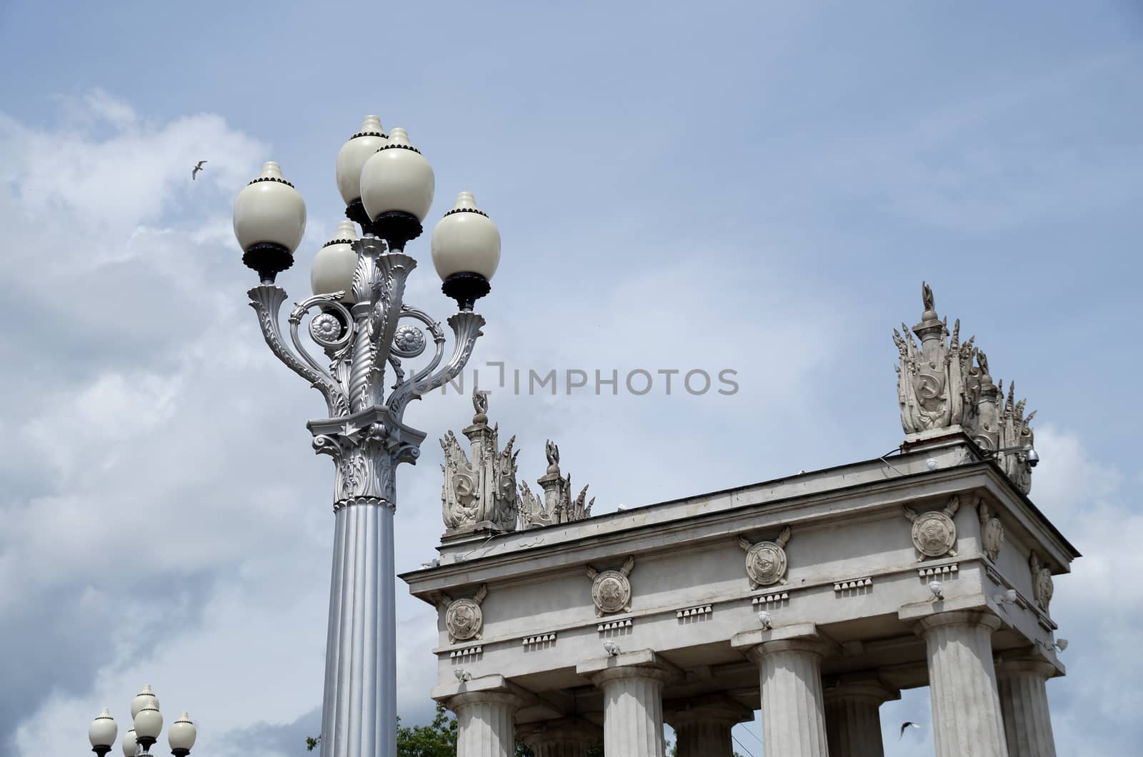 Rotunda and lamps on the embankment of the city by Vadimdem