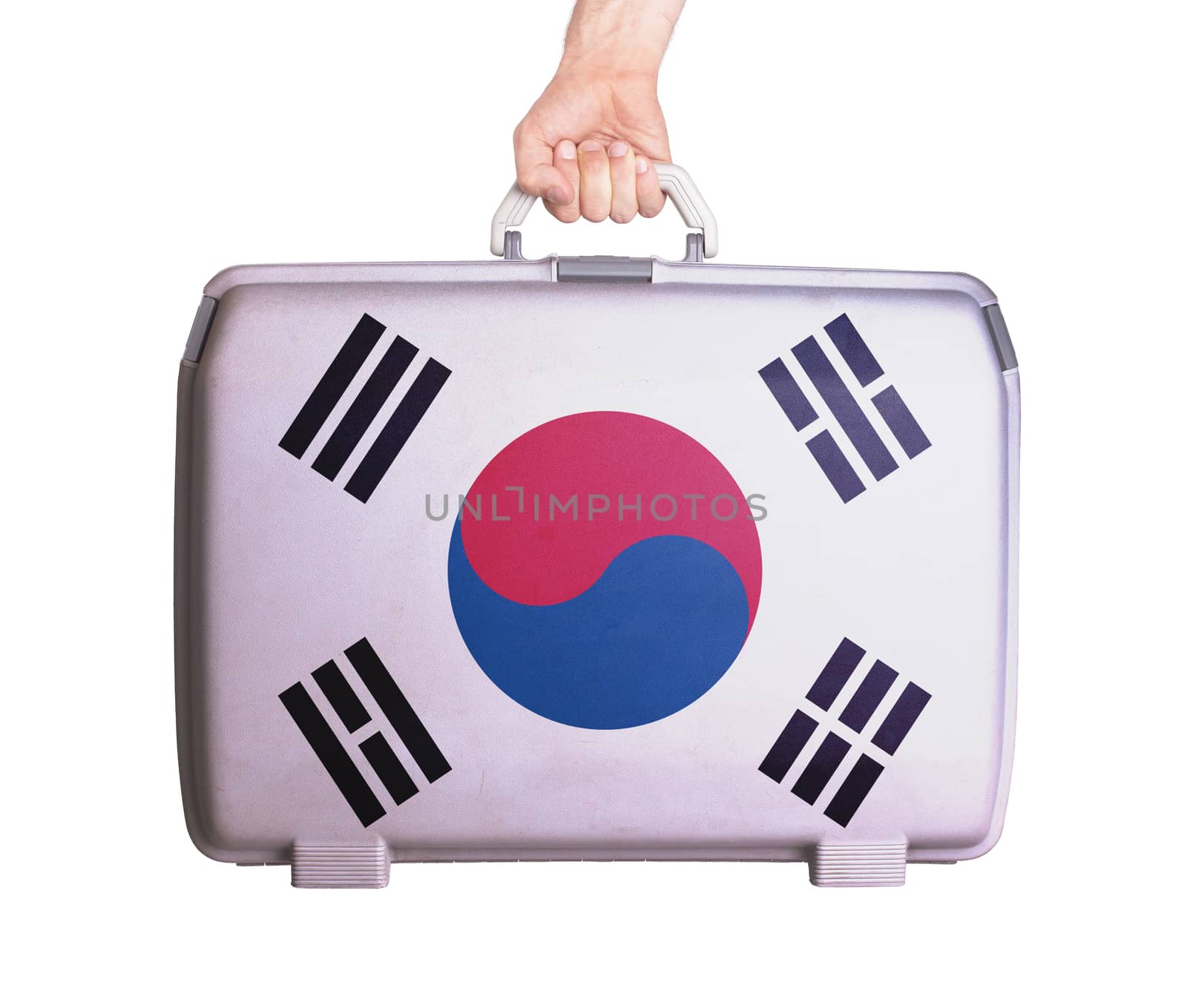 Used plastic suitcase with stains and scratches, printed with flag, South Korea