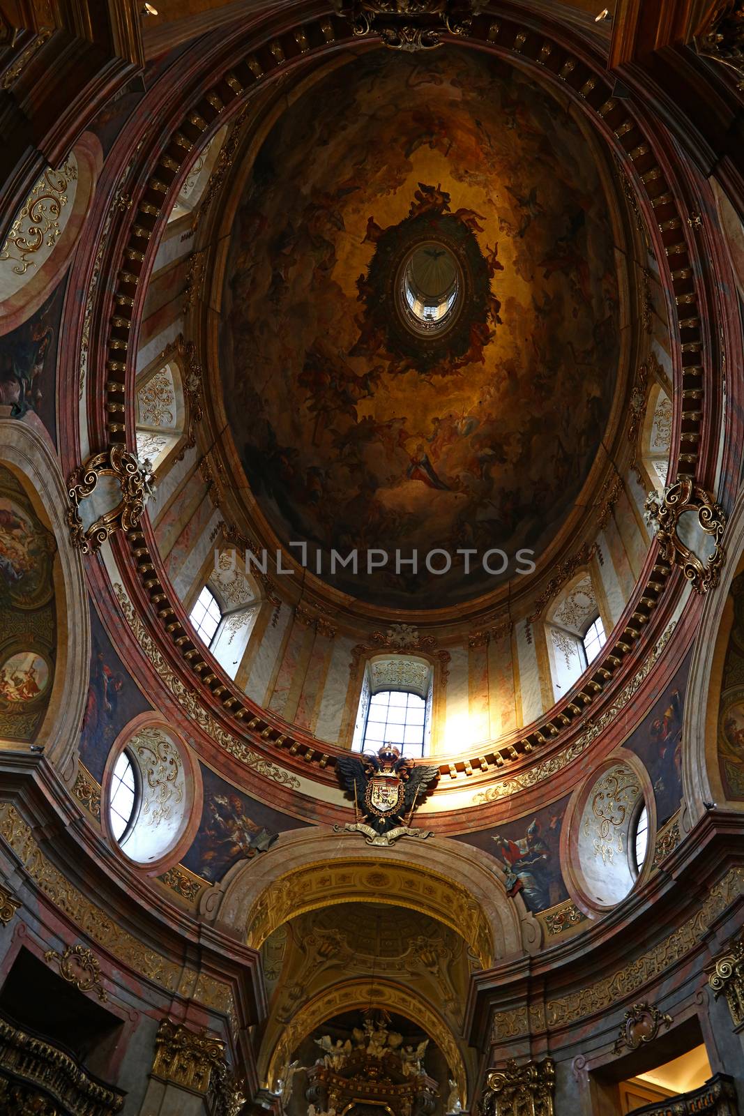 Low angle view of beautiful cupola with fresco of historic baroque church of Saintt Peter in Vienna, Austria
