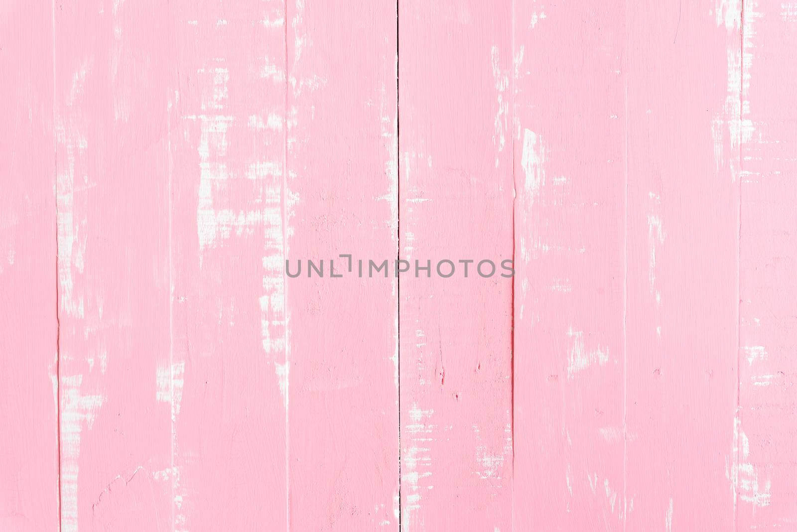 Pastel white and pink wooden table background texture.