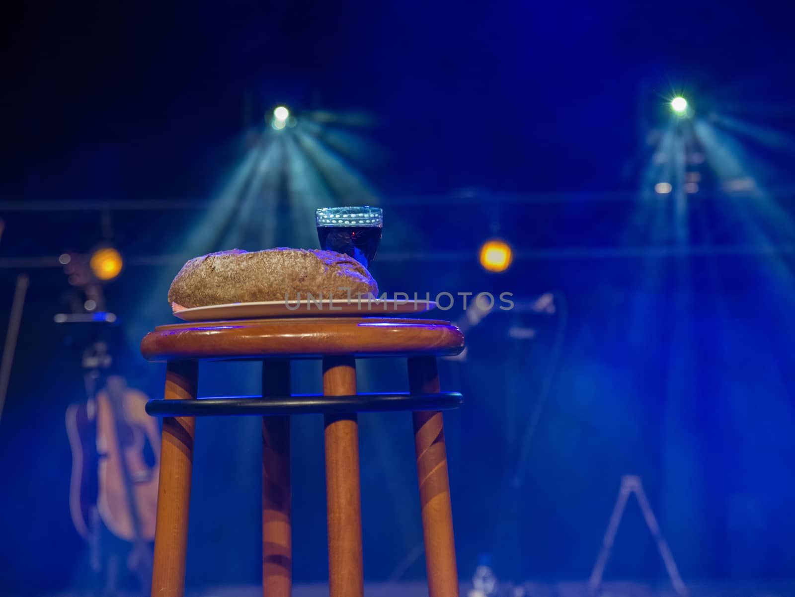 table in a church with holy supper bread and wine, the body of christ