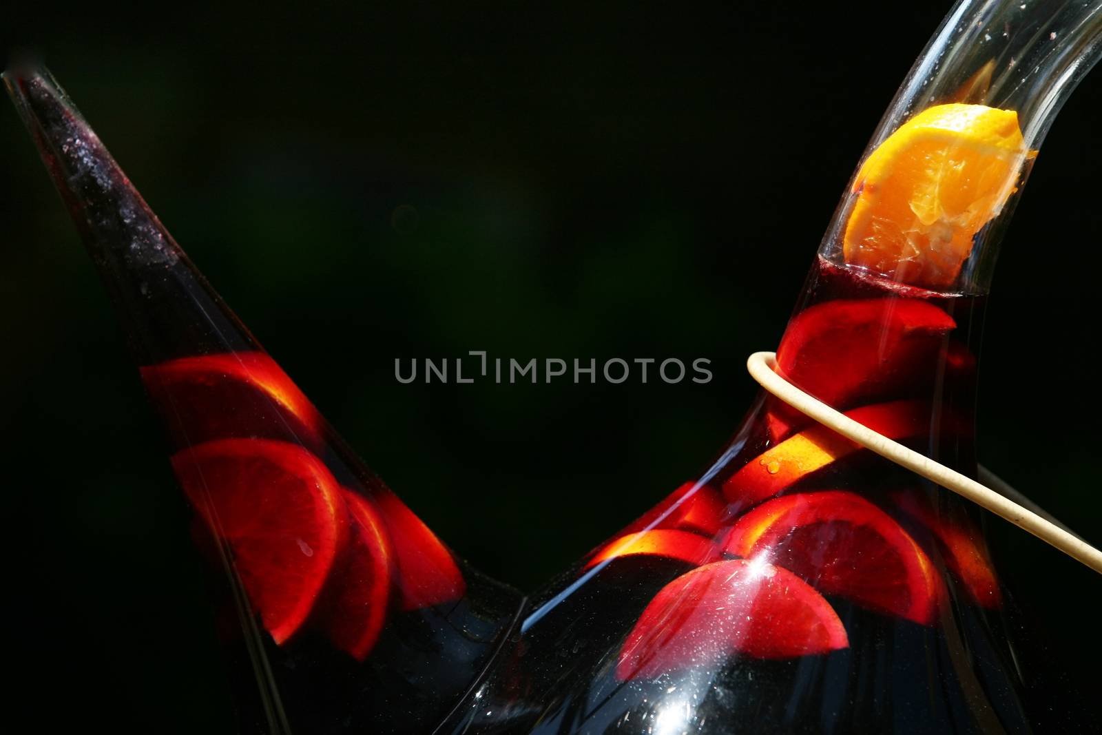 Jugs of sangria on a black background