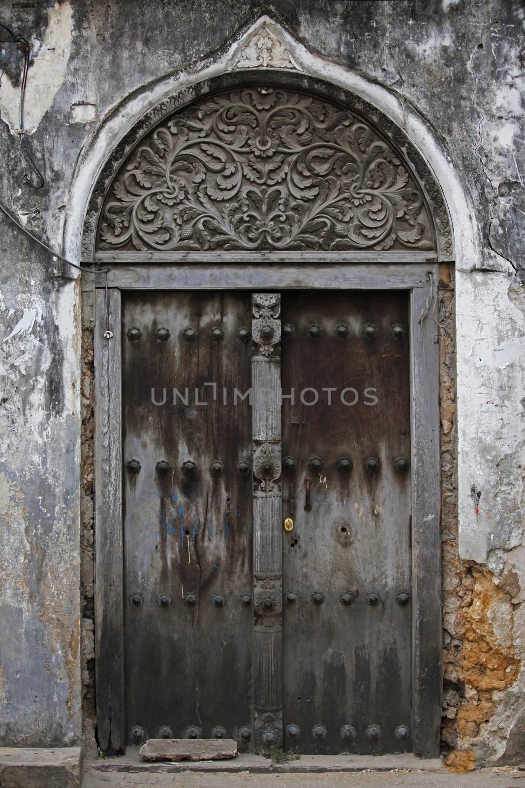 Old wooden door at Stone Town the capital of Zanzibar island East Africa. Zanzibar
