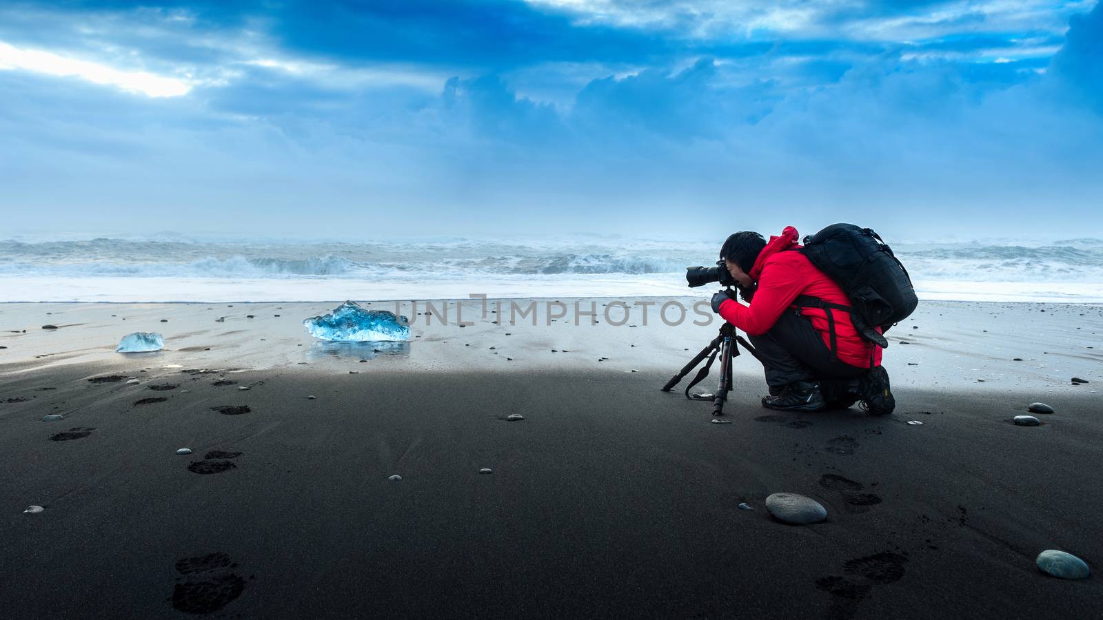Photographer take a photo at ice in Iceland. by gutarphotoghaphy